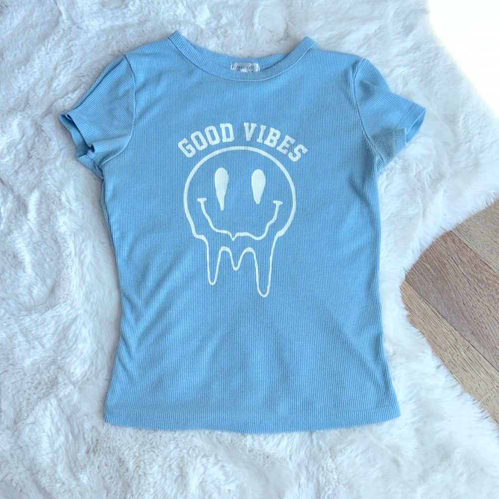Good vibes, blue shirt with melting smiley face 🙂